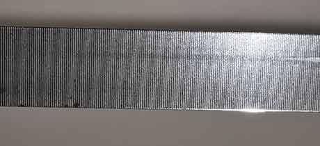 Optical encoder strip used for position feedback